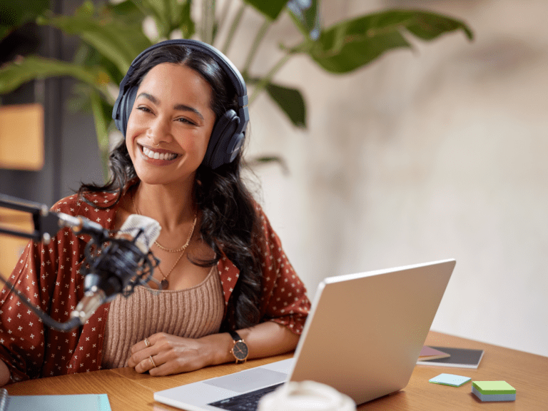 A woman listening to headphones and talking on mic